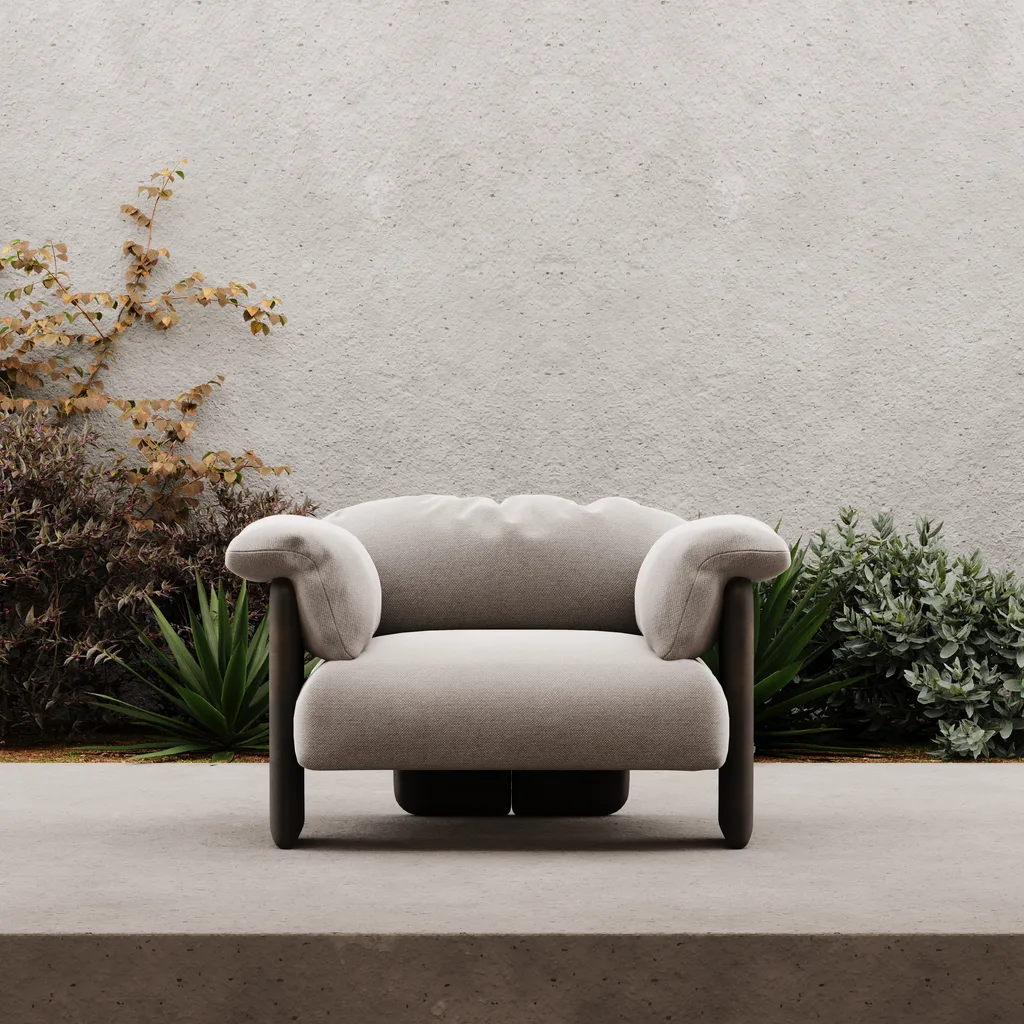 Poltrona plissada Meta em varanda com jardim